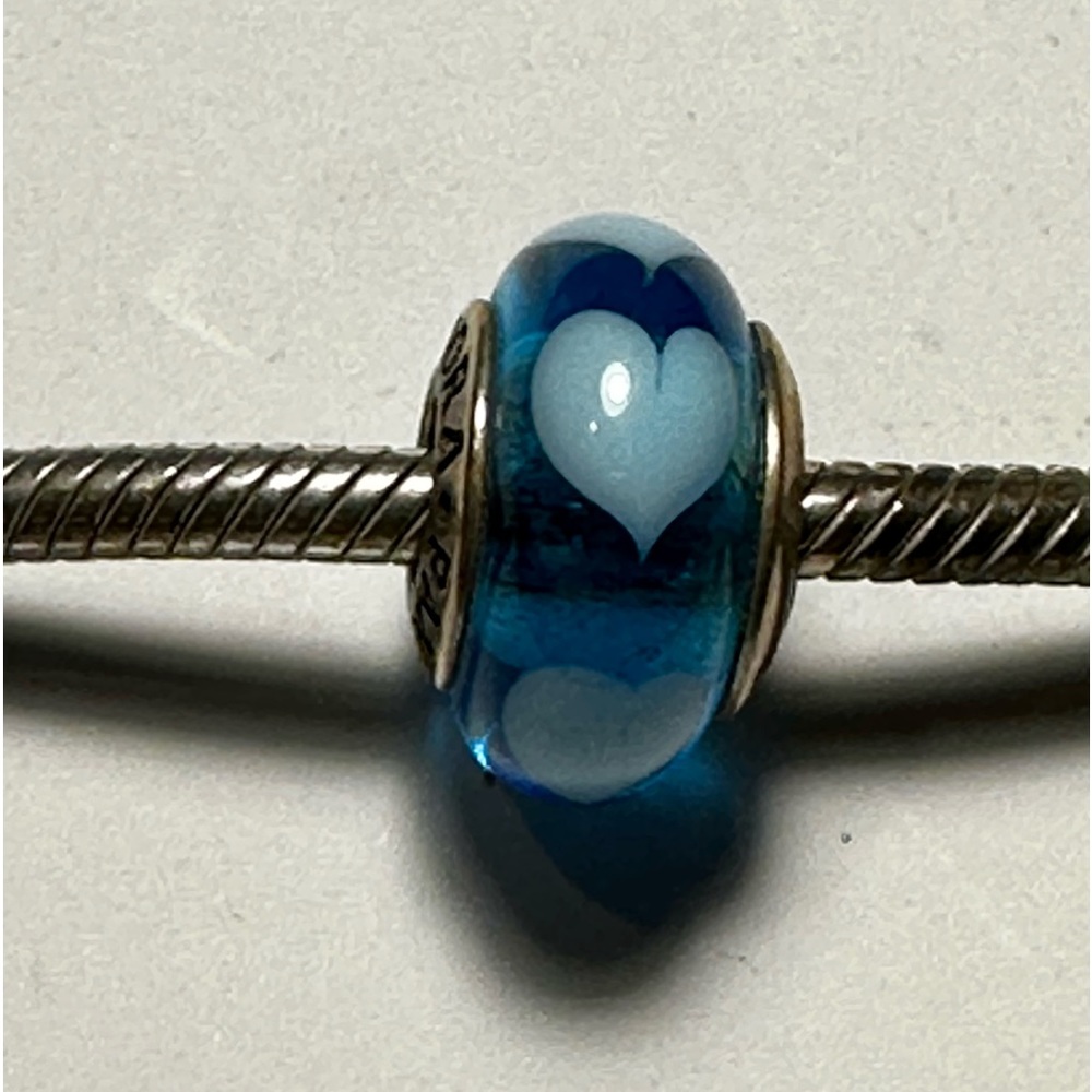 Pandora charm. Blue with light blue hearts.